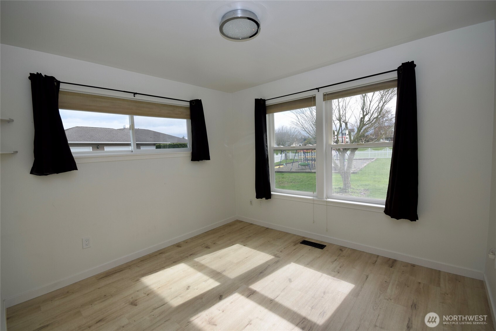 71 John Carl Road Sequim, WA 98382 - Photo 23 of 37 a view of room with window and a ceiling fan