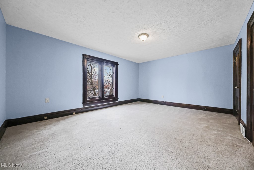 3401 Waterloo Road Mogadore, OH 44260 - Photo 32 of 50 Empty room featuring a textured ceiling and light colored carpet