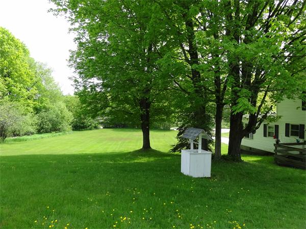 40 Moran Road Hardwick, MA 01031 - Photo 3 of 15 a view of a white house with a big yard and large trees