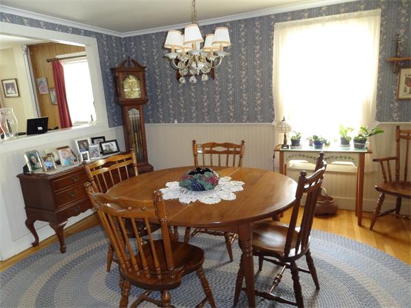 40 Moran Road Hardwick, MA 01031 - Photo 8 of 15 a view of a dining room with furniture a chandelier and wooden floor