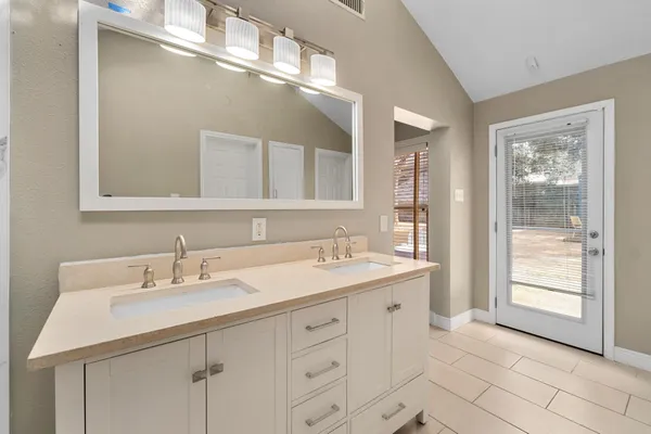 a bathroom with a sink and a mirror