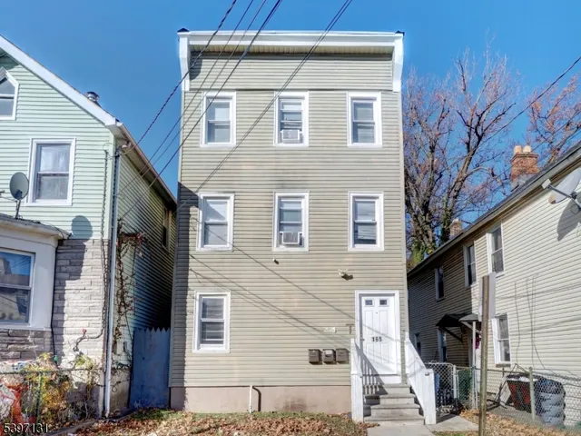 a view of a house with a tree