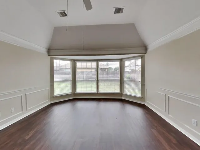 a view of room with window and hardwood floor