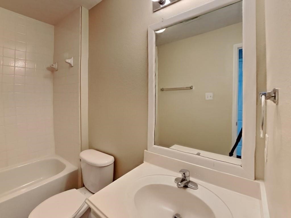 439 Pinewood Ridge Drive Spring, TX 77386 - Photo 15 of 18 a bathroom with a sink a toilet and shower