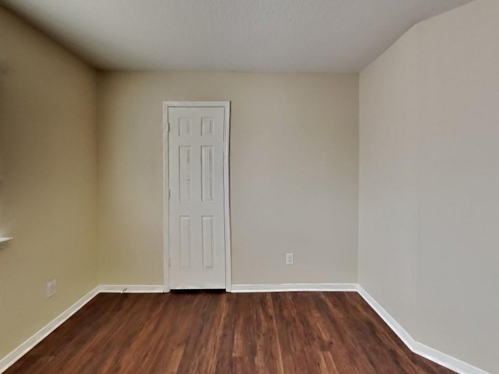 439 Pinewood Ridge Drive Spring, TX 77386 - Photo 16 of 18 a view of an empty room with wooden floor