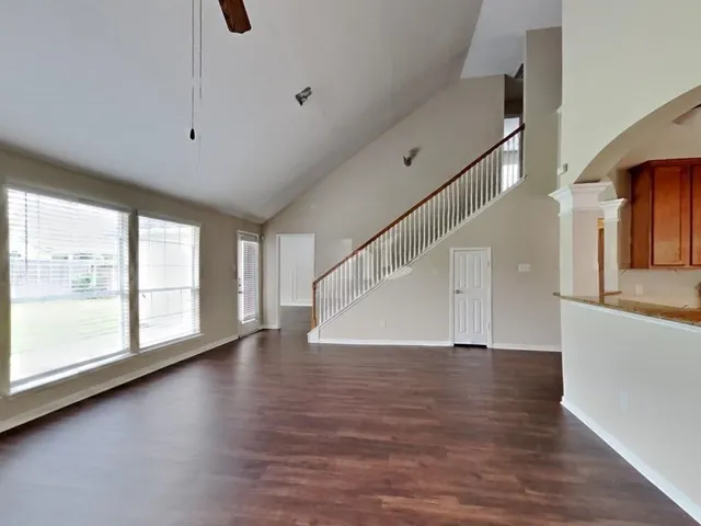 a view of an entryway with wooden floor