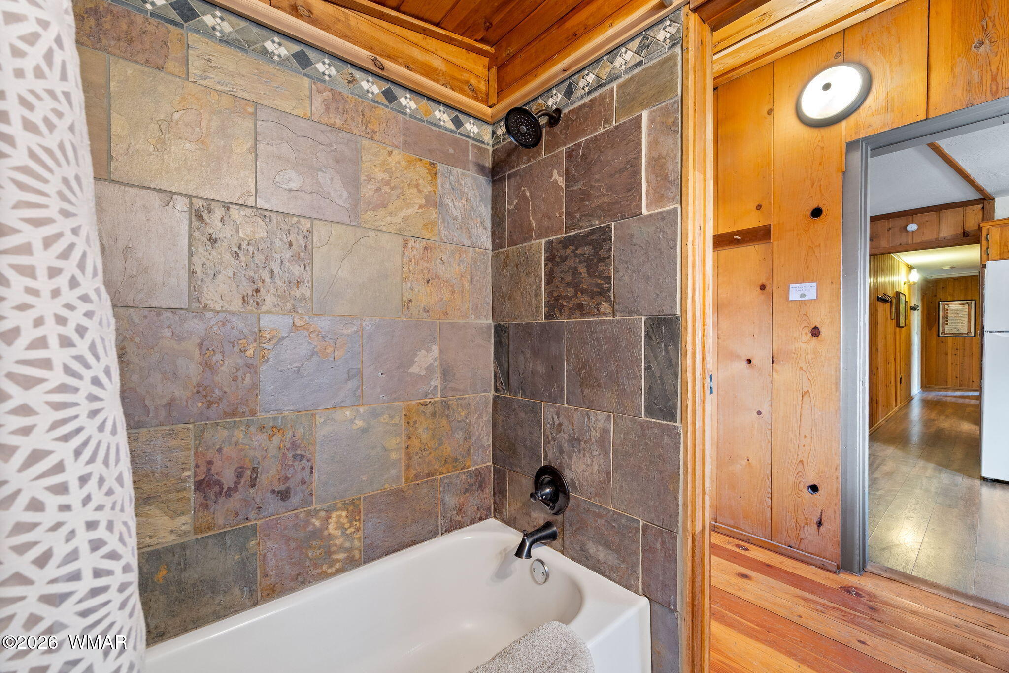85 Main Street Greer, AZ 85927 - Photo 24 of 55 a bathroom with a tub and shower