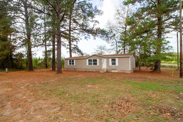 a front view of a house with yard