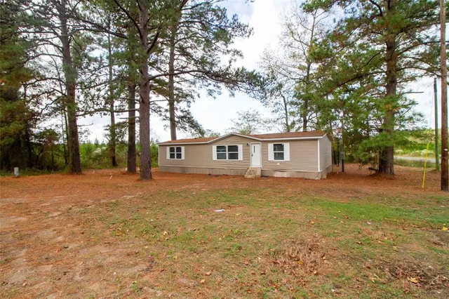 a front view of a house with yard