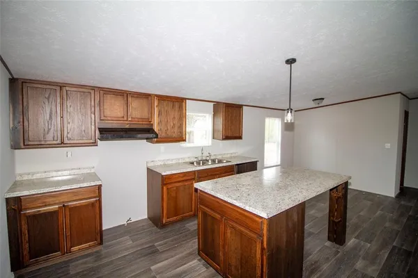 a kitchen with sink cabinets and window
