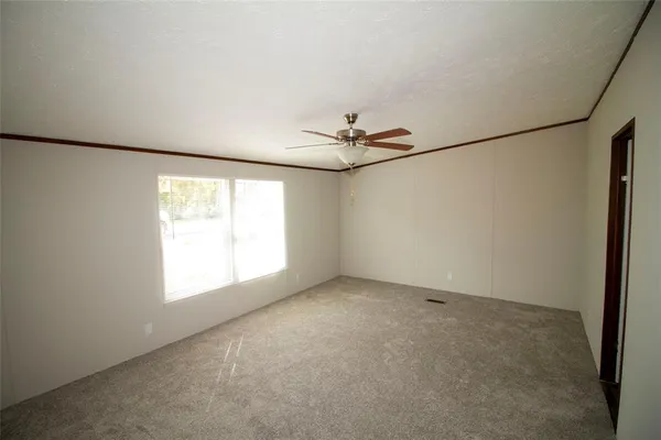 a view of empty room with windows