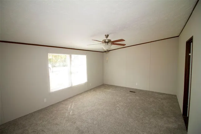 a view of empty room with windows