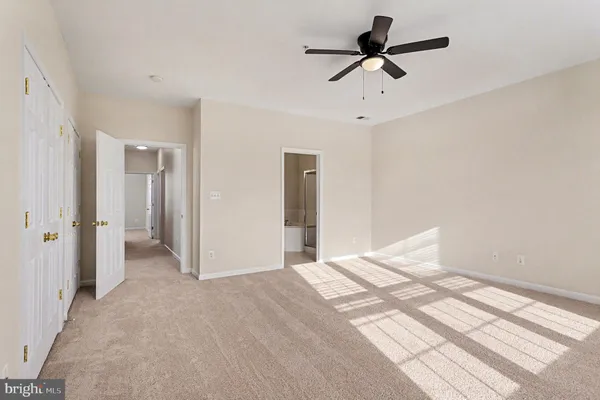 a very nice looking room with a ceiling fan