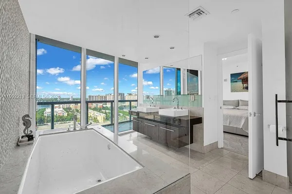 a bathroom with a tub and shower