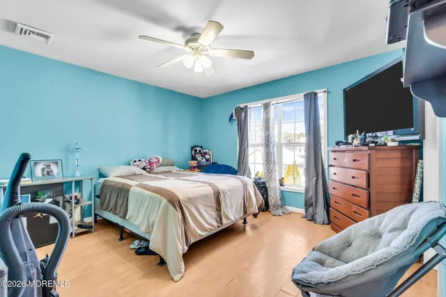 a bedroom with a bed and furniture