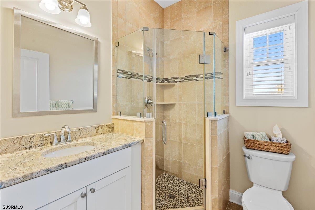 16 South Decatur Avenue, Unit A Margate City, NJ 08402 - Photo 23 of 51 a bathroom with a granite countertop sink toilet and shower