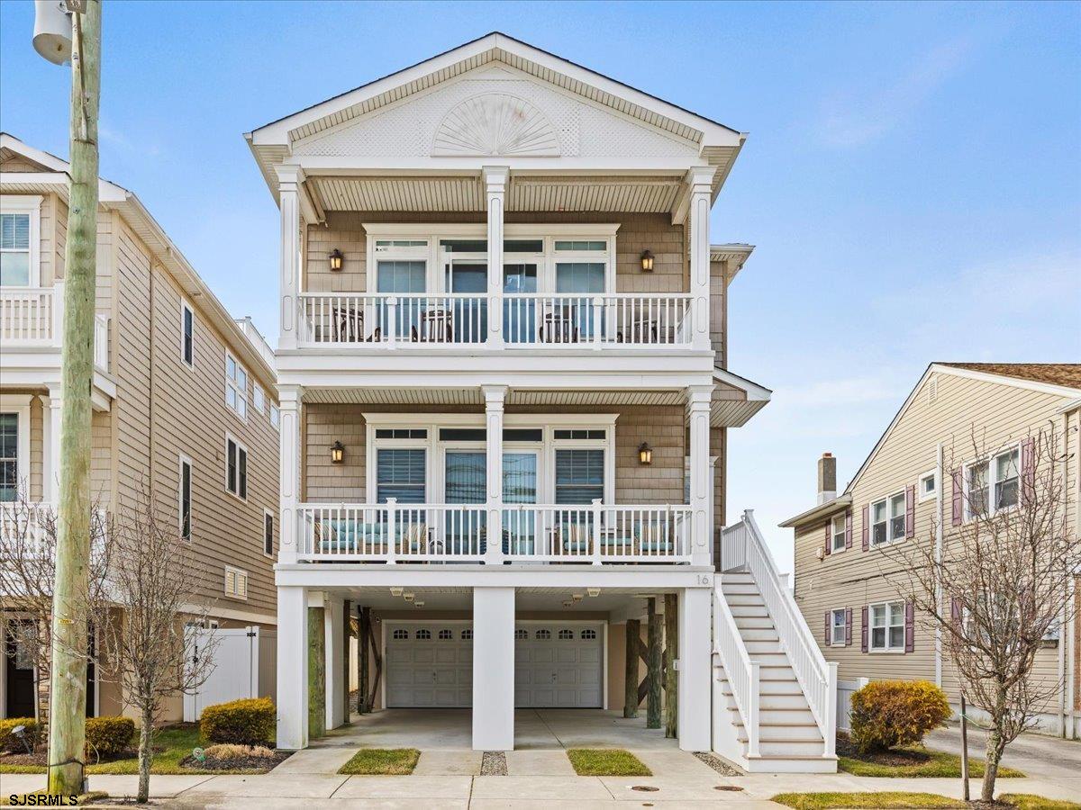 16 South Decatur Avenue, Unit A Margate City, NJ 08402 - Photo 3 of 51 a front view of a building with a lot of windows