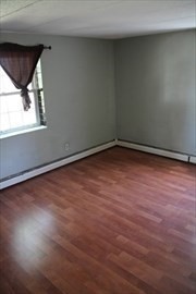 10 Skyline Drive, Unit 5 Braintree, MA 02184 - Photo 7 of 13 a view of empty room with wooden floor and fan