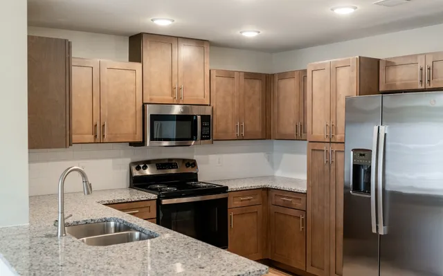 an empty room with wooden floor