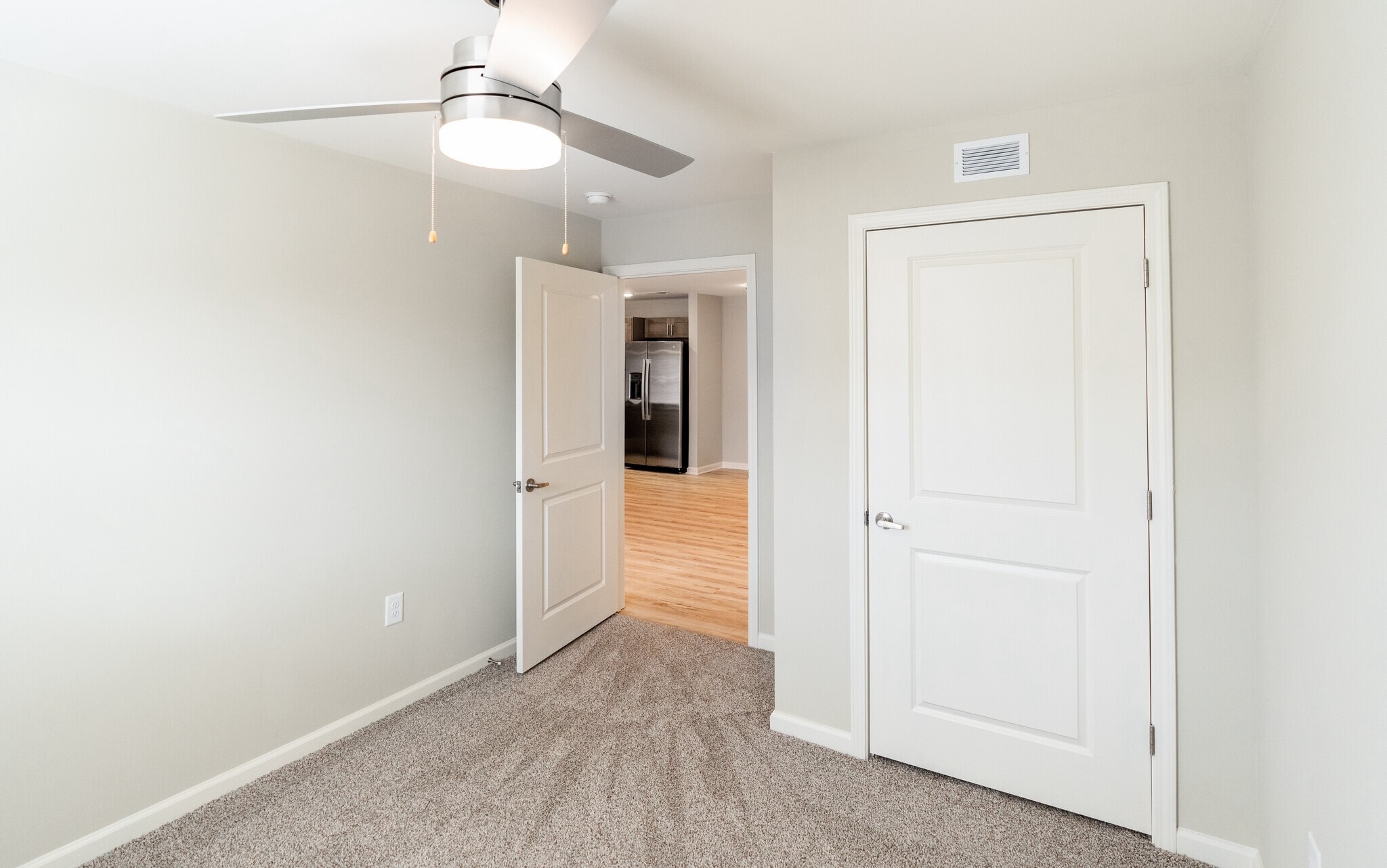 3432 Carr Road Durham, NC 27703 - Photo 15 of 28 an empty room with an entryway door and fan