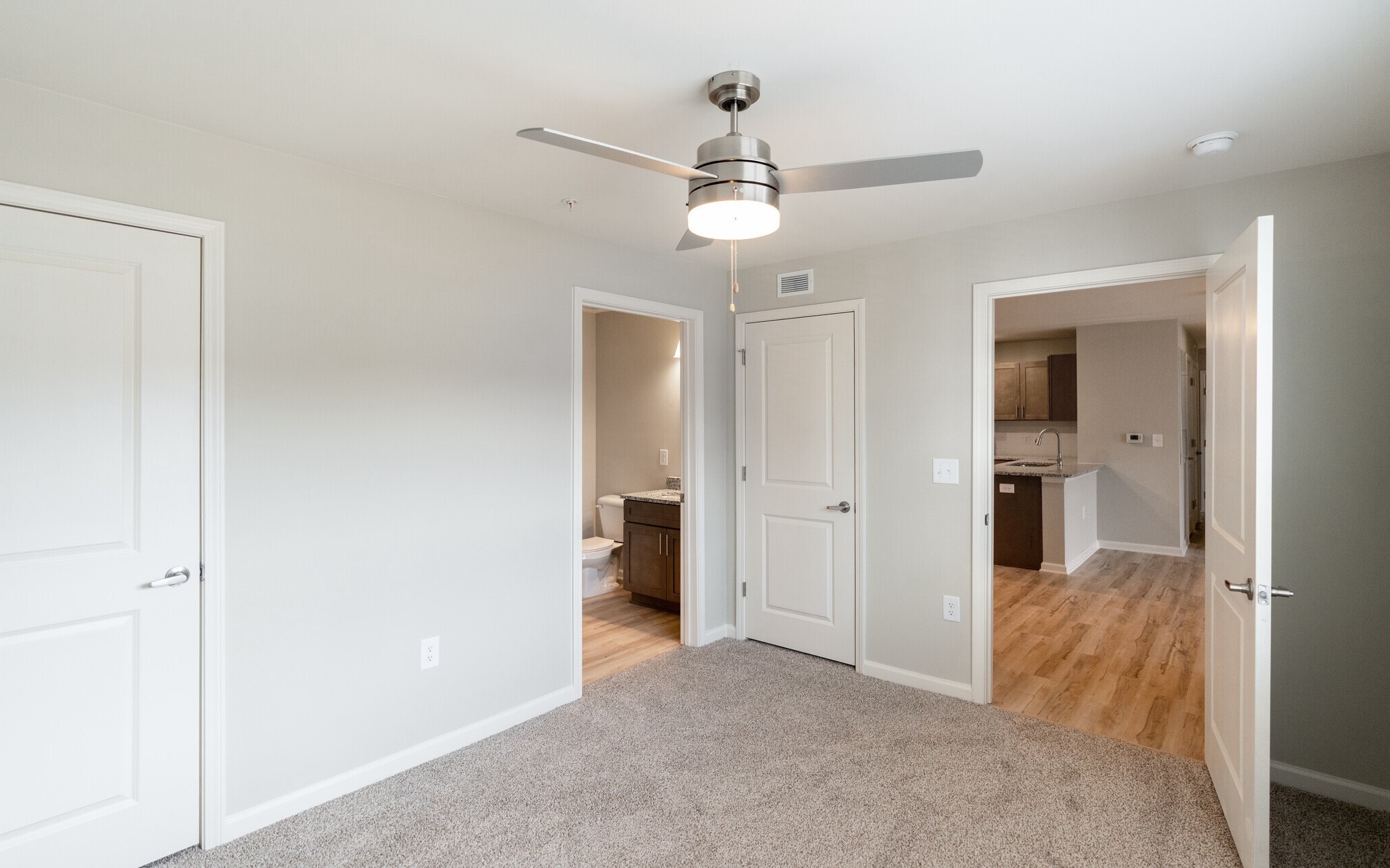 3432 Carr Road Durham, NC 27703 - Photo 17 of 28 a view of a room with a stylish ceiling fan and entryway