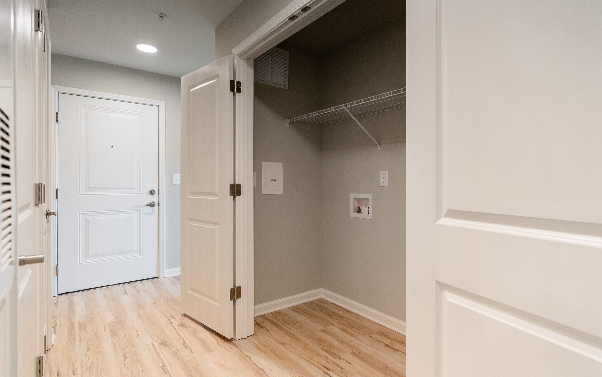 3432 Carr Road Durham, NC 27703 - Photo 19 of 28 a view of a hallway with wooden floor and closet