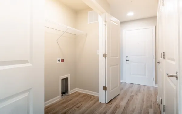 a bathroom with a granite countertop sink a toilet and a mirror