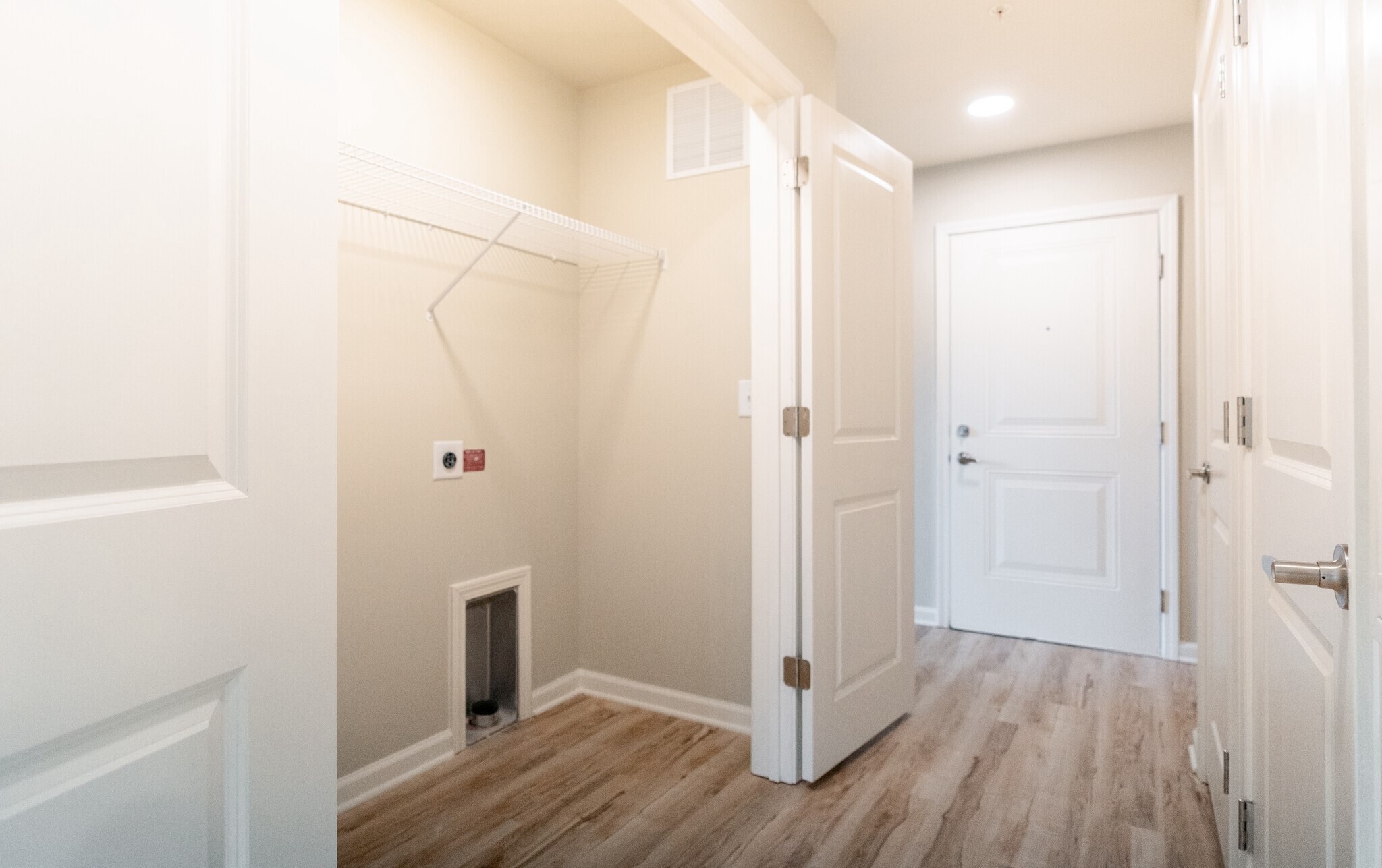 3432 Carr Road Durham, NC 27703 - Photo 20 of 28 a view of a hallway with wooden floor and closet area