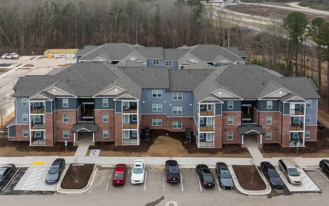 a front view of a house with parking space