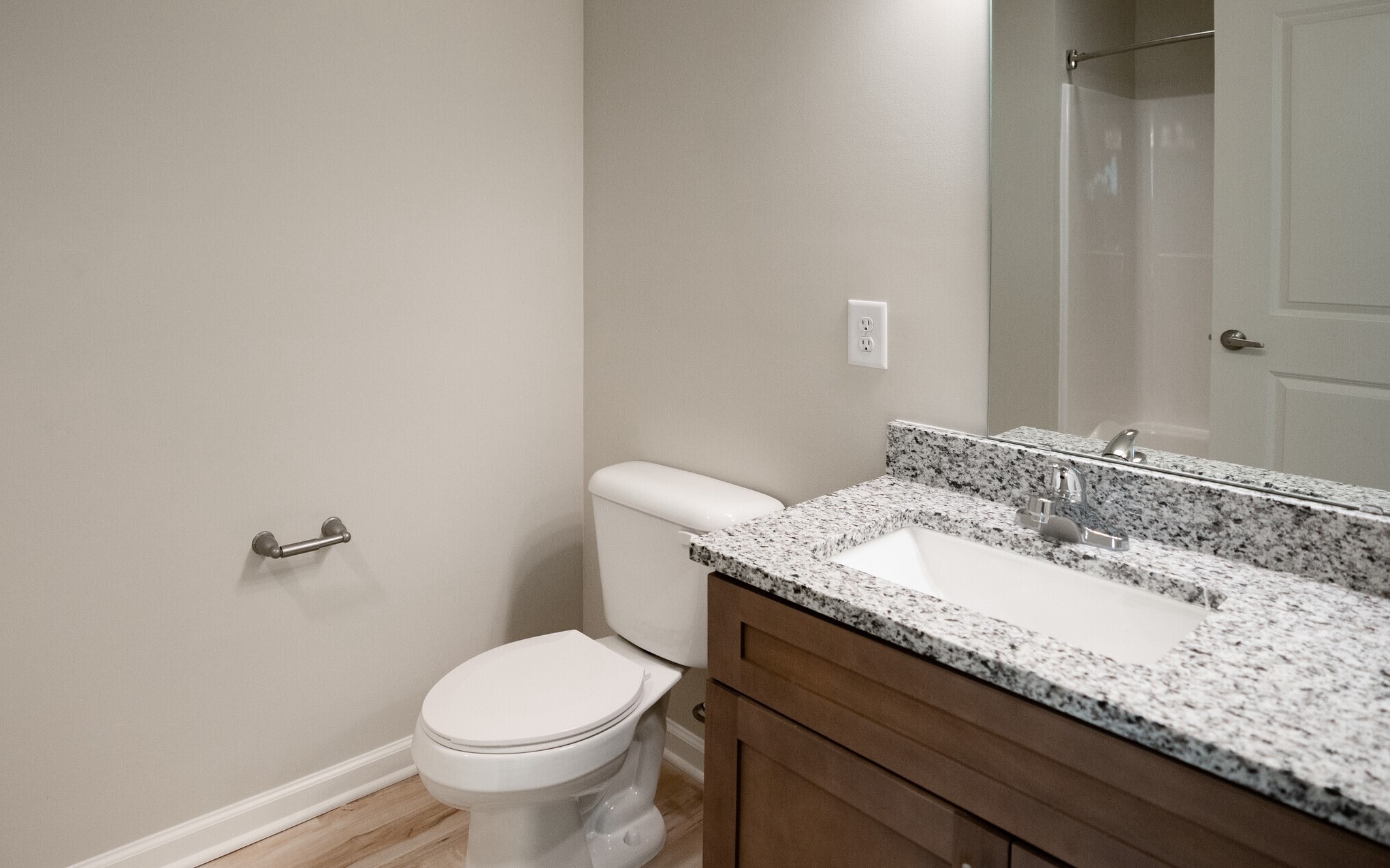 3432 Carr Road Durham, NC 27703 - Photo 24 of 28 a bathroom with a granite countertop sink a toilet and a mirror