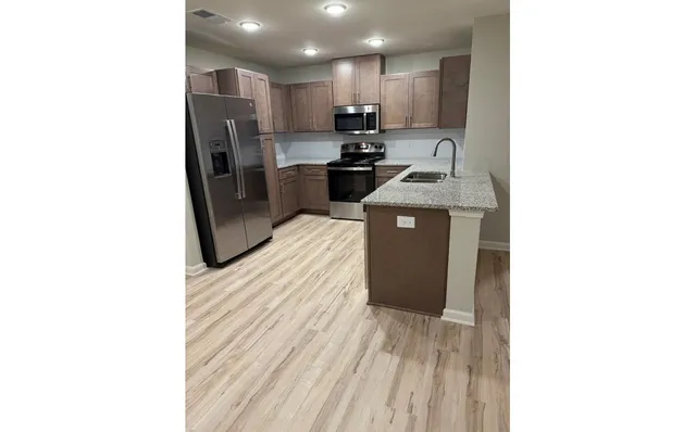 a view of a kitchen with a sink