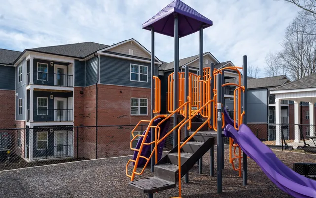 a view of a house with a bench in front of it
