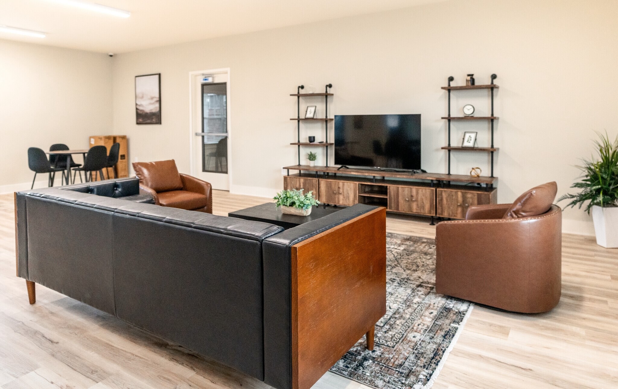 3432 Carr Road Durham, NC 27703 - Photo 9 of 28 a living room with furniture and a flat screen tv