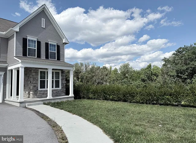 a large house with a lot of plants