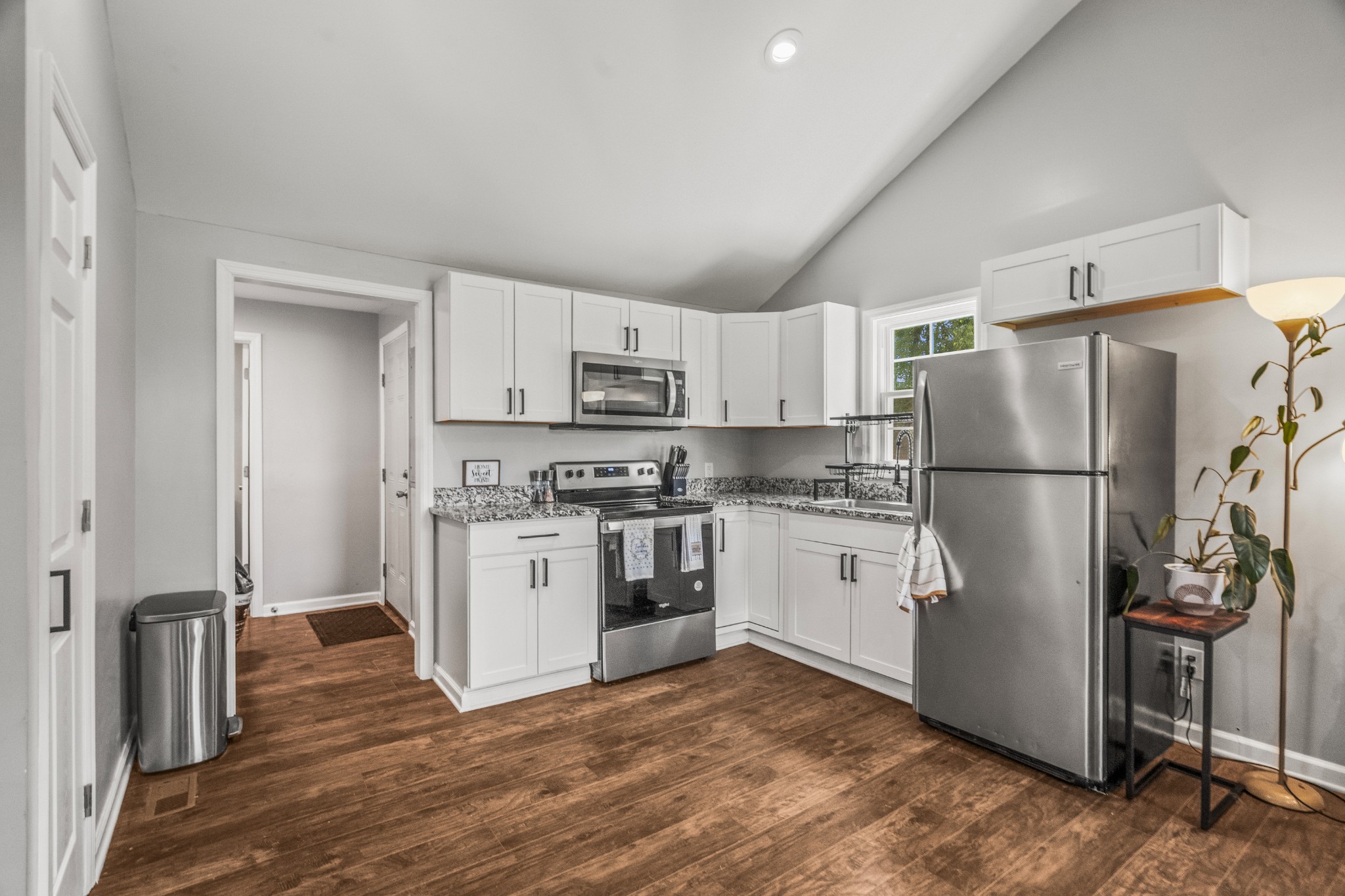 3240 Academy Road Portland, TN 37148 - Photo 12 of 39 a kitchen with stainless steel appliances granite countertop a refrigerator stove a sink and dishwasher
