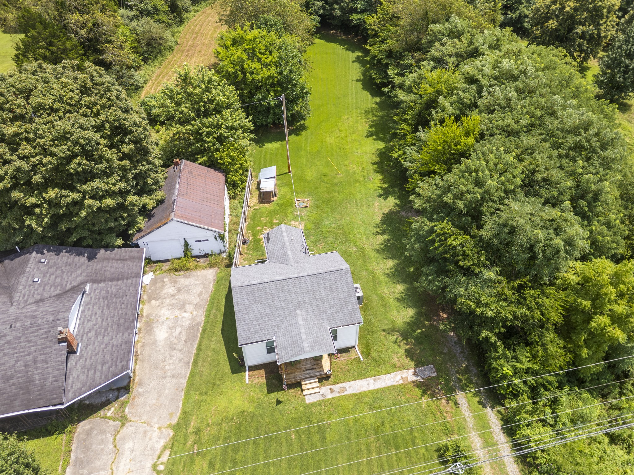 3240 Academy Road Portland, TN 37148 - Photo 31 of 39 an aerial view of a house with swimming pool and trees