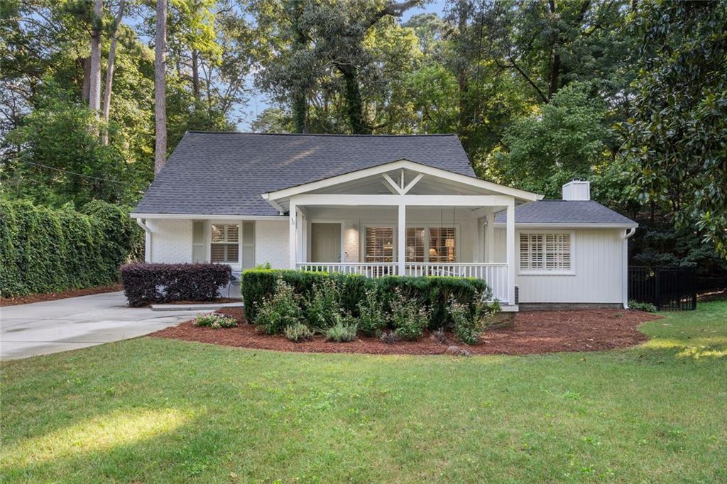 2681 Ridgemore Place Northwest Atlanta, GA 30318 - Photo 1 of 1 a front view of a house with yard and green space