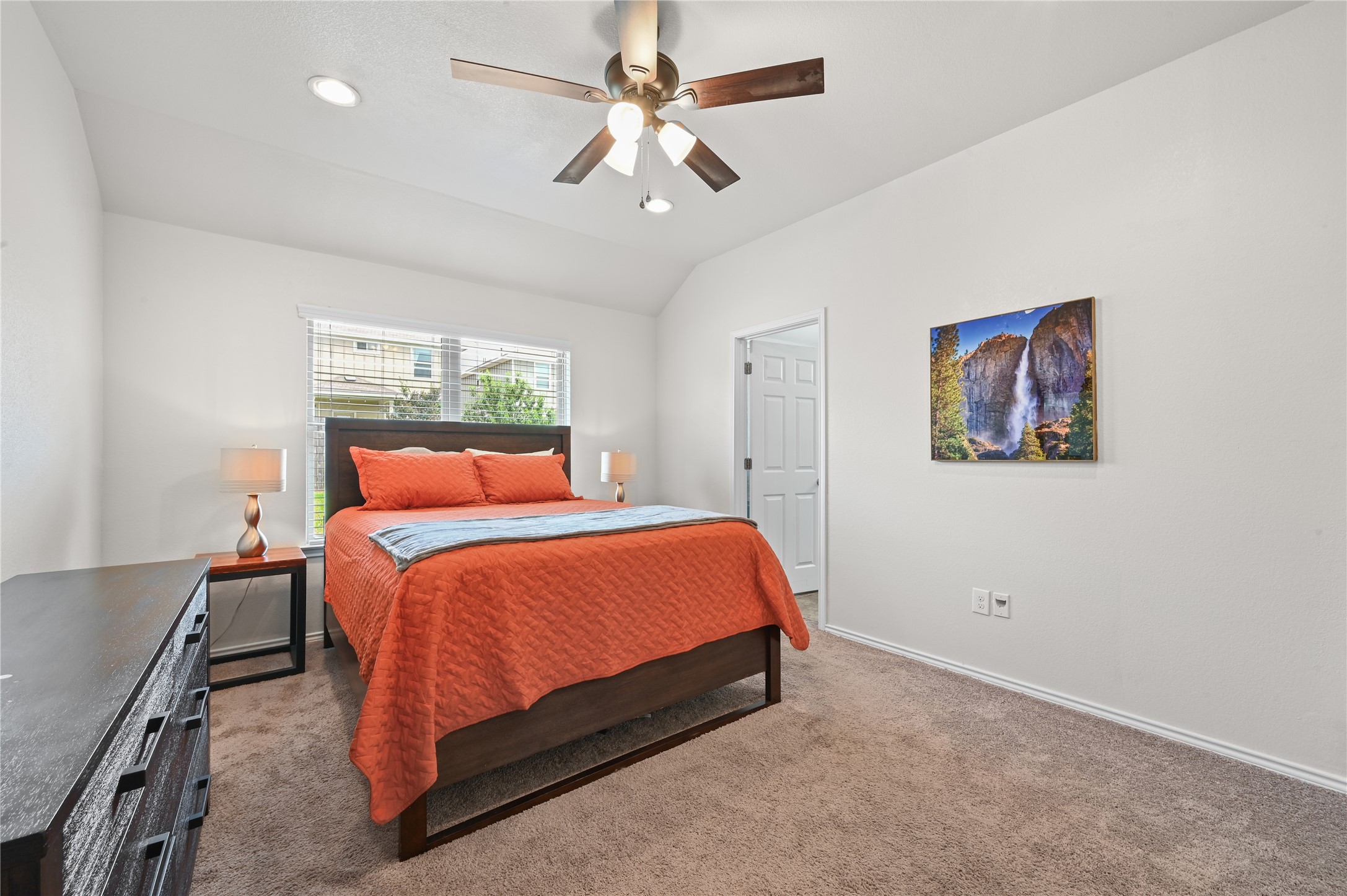 303 Limerick Road Buda, TX 78610 - Photo 11 of 23 Carpeted bedroom featuring white walls, a vaulted ceiling, and recessed lighting