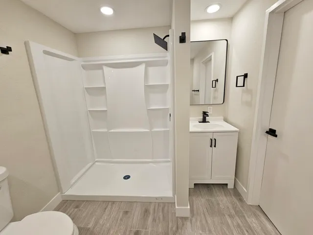 a bathroom with a tub and shower