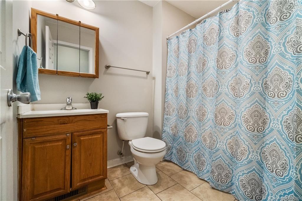 2879 Ranger Road Clover, SC 29710 - Photo 12 of 30 a bathroom with a granite countertop sink toilet and a mirror