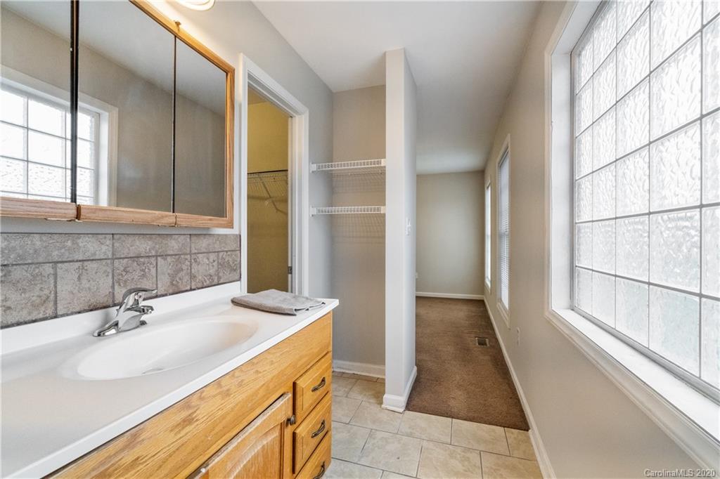 2879 Ranger Road Clover, SC 29710 - Photo 17 of 30 a bathroom with a sink and a large mirror