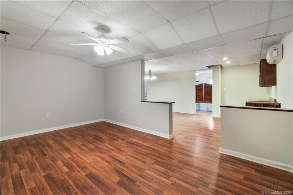 2879 Ranger Road Clover, SC 29710 - Photo 23 of 30 an empty room with wooden floor and windows