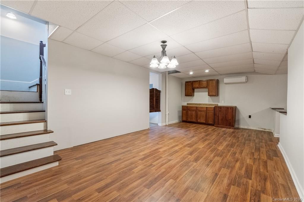 2879 Ranger Road Clover, SC 29710 - Photo 24 of 30 a big room with wooden floor and chandelier