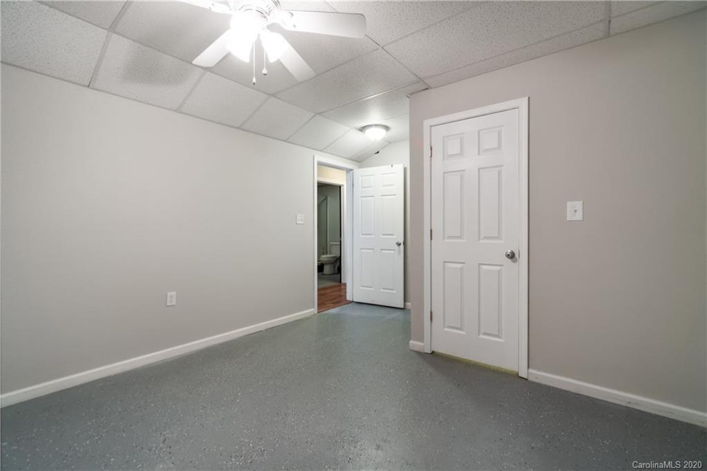 2879 Ranger Road Clover, SC 29710 - Photo 27 of 30 an empty room with a ceiling fan and bathroom