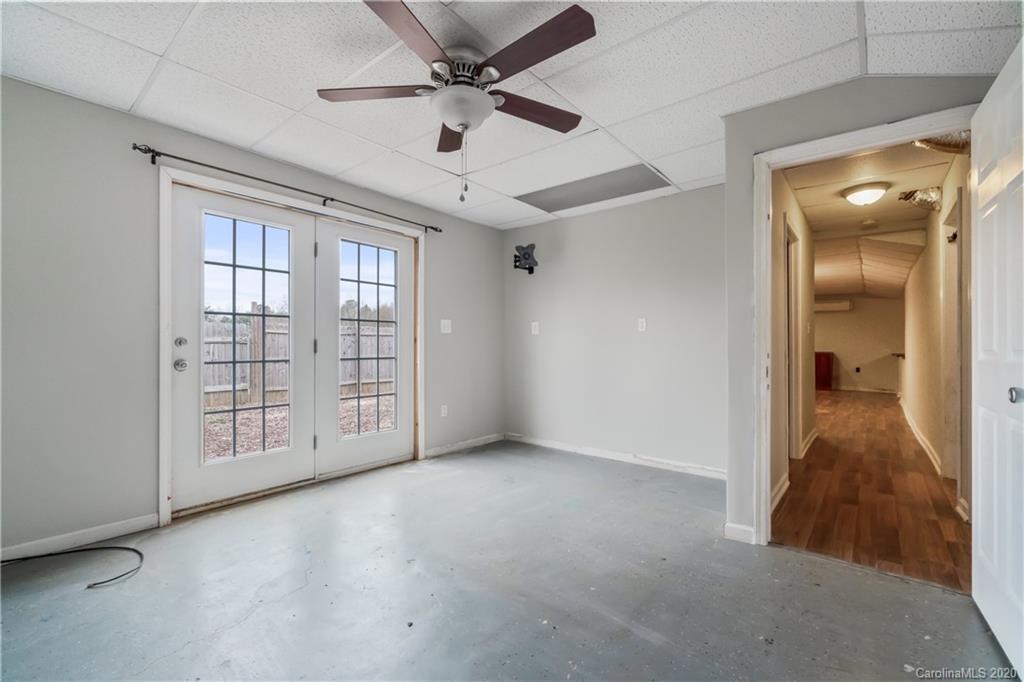 2879 Ranger Road Clover, SC 29710 - Photo 28 of 30 an empty room with chandelier fan and windows