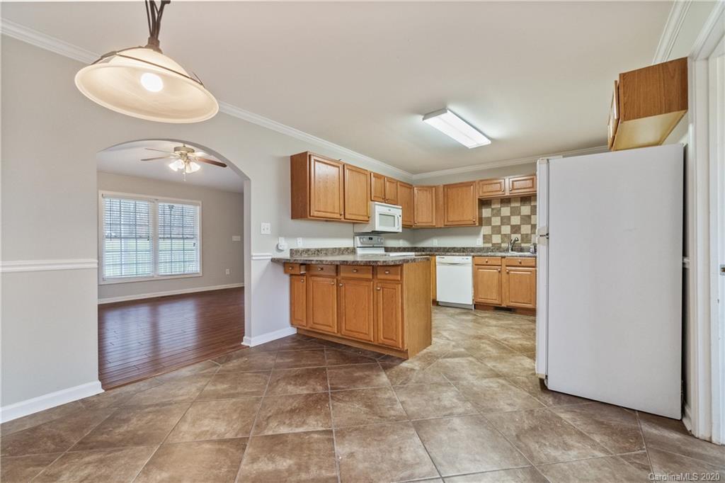 2879 Ranger Road Clover, SC 29710 - Photo 7 of 30 a kitchen with stainless steel appliances granite countertop a stove refrigerator and cabinets