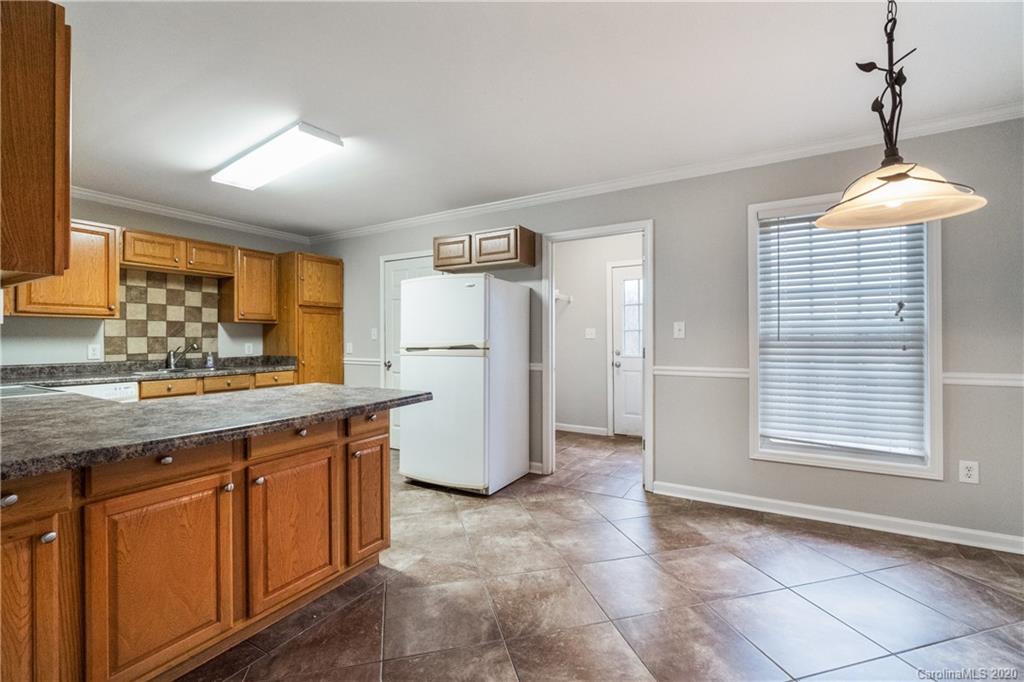 2879 Ranger Road Clover, SC 29710 - Photo 8 of 30 a kitchen with refrigerator and window