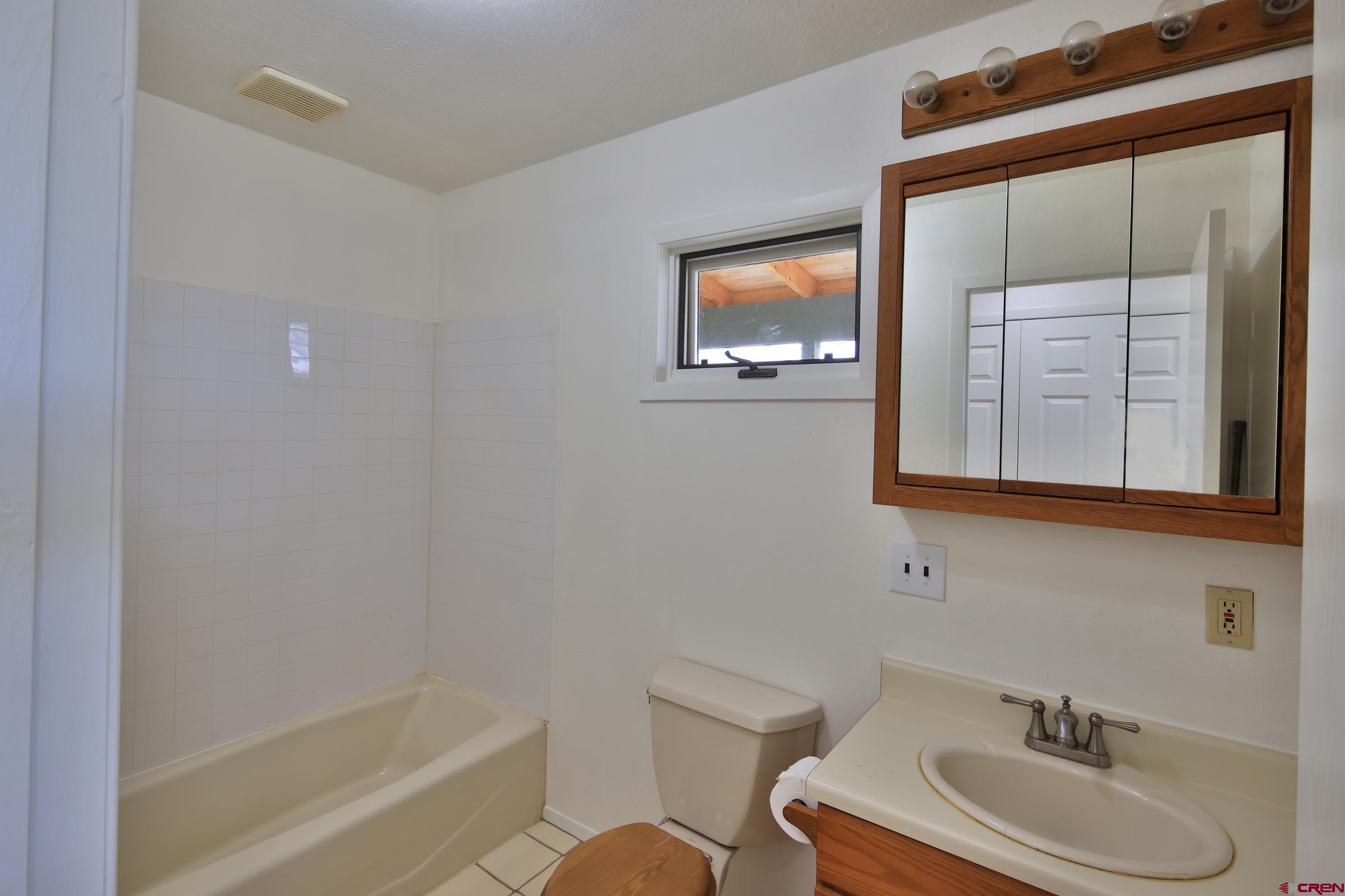 13637 Happy Hollow Road Eckert, CO 81418 - Photo 17 of 38 a bathroom with a sink and a mirror