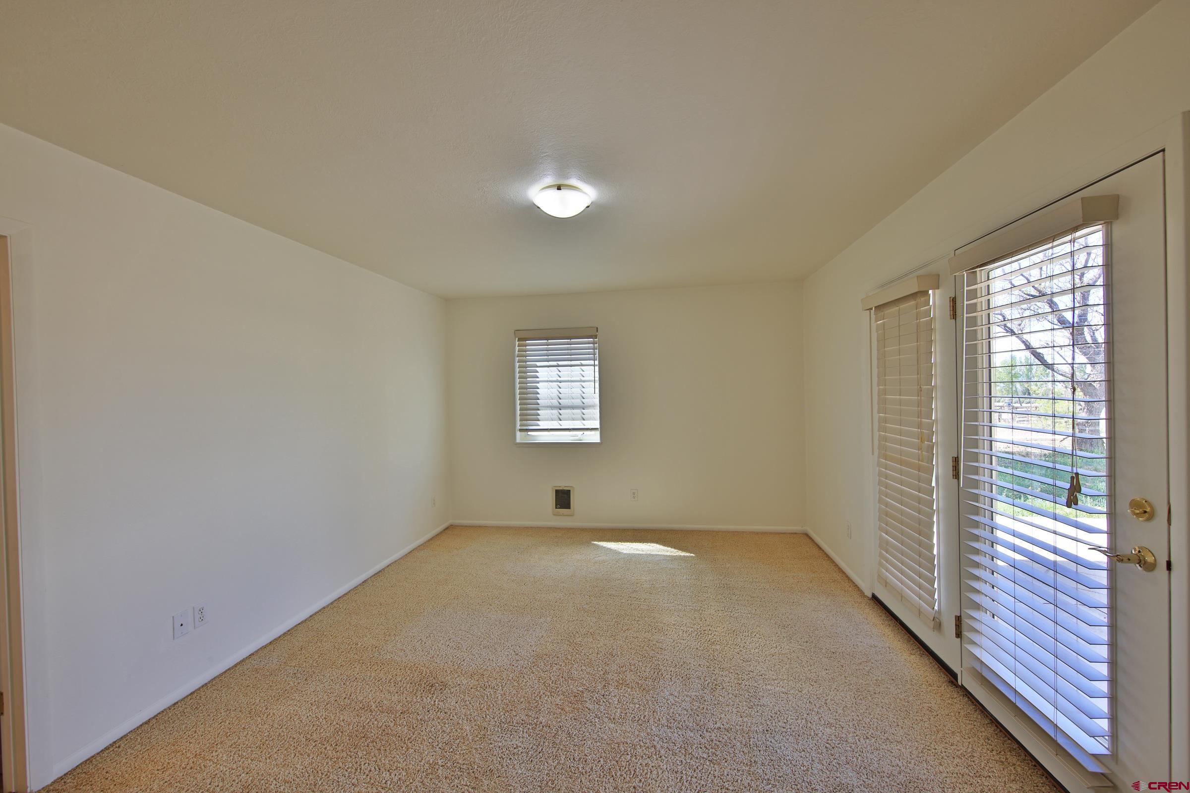 13637 Happy Hollow Road Eckert, CO 81418 - Photo 18 of 38 a view of an empty room with a window