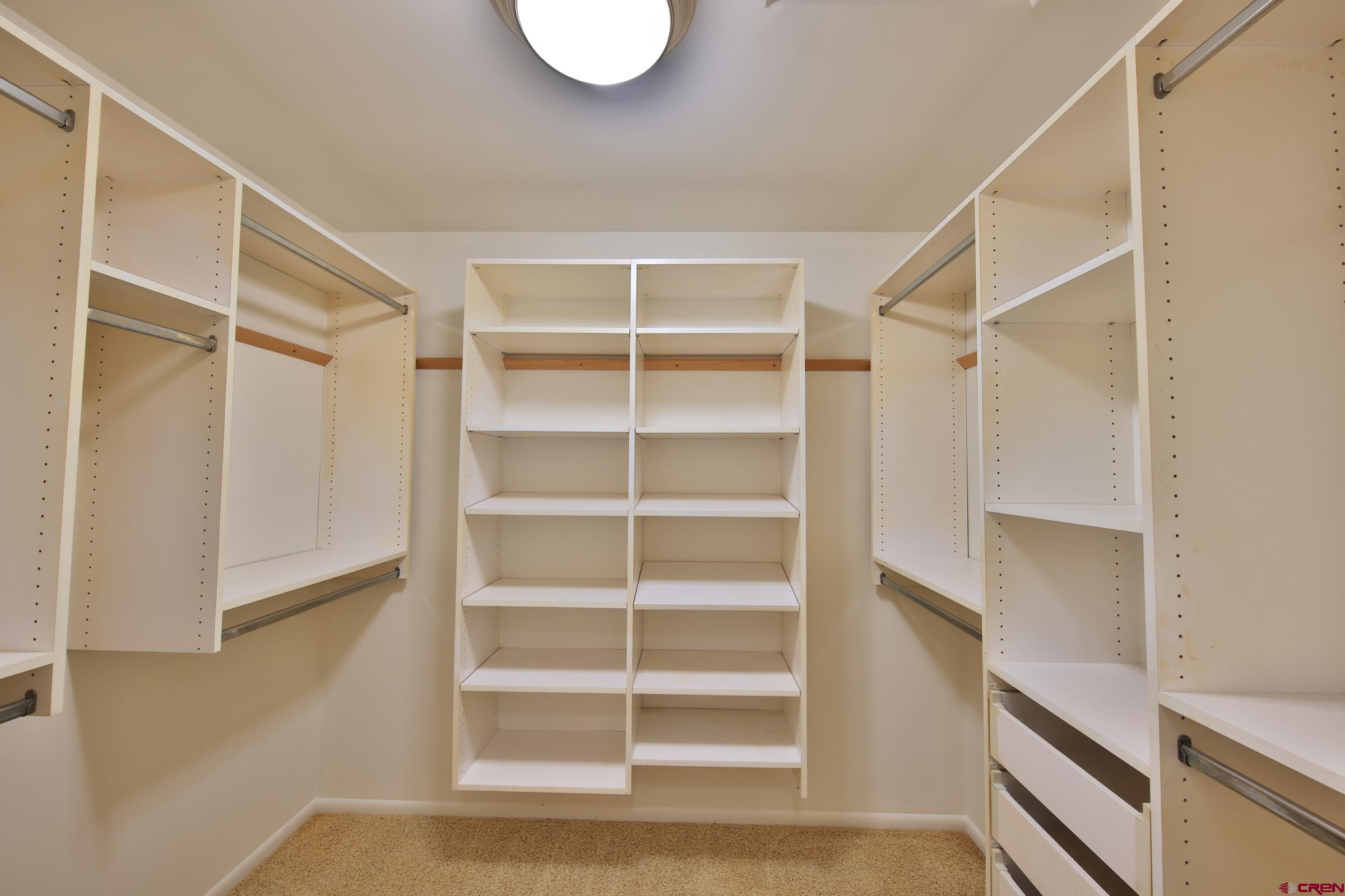 13637 Happy Hollow Road Eckert, CO 81418 - Photo 20 of 38 a view of walk in closet with empty racks